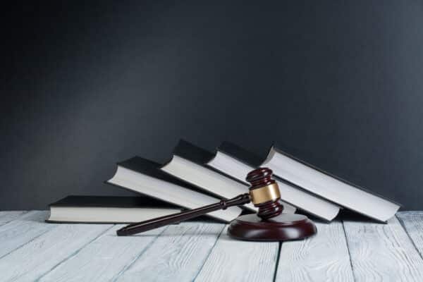 Law Concept - Open Law Book With A Wooden Gavel